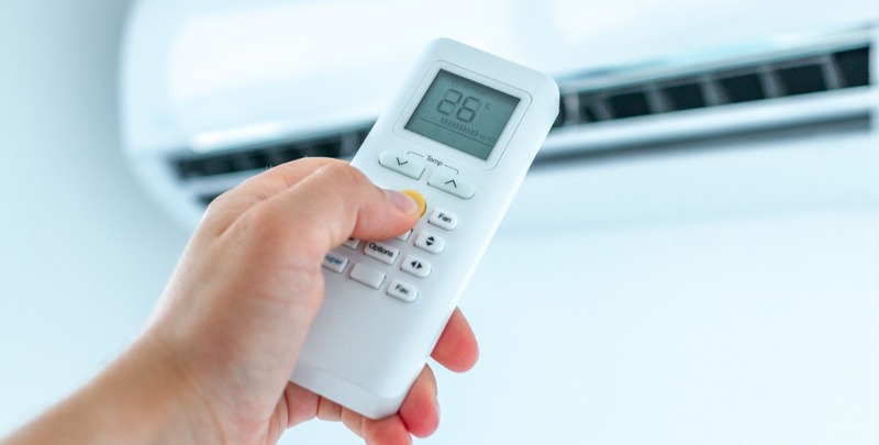 Adjusting the temperature on an air conditioner