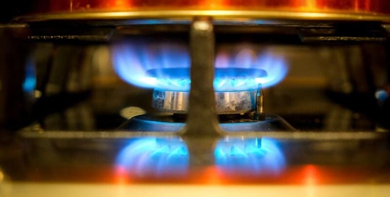 Gas powered stove burner turned on