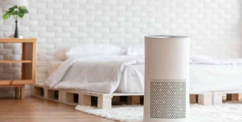 air purifier in cozy white bed room for filter and cleaning removing picture
