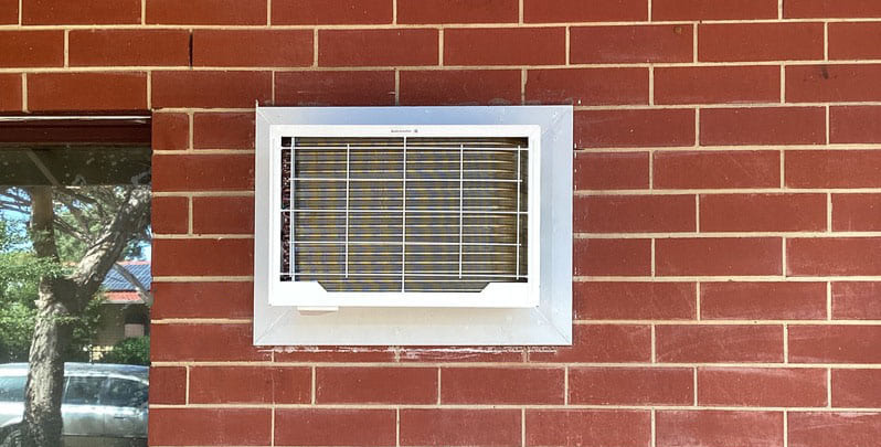 front on view of window air conditioner from outside the house